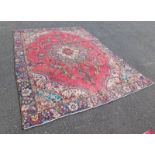 RED GROUND PERSIAN TREES MULTICOLOURED CARPET WITH A MEDALLION DESIGN 230 X 315CM