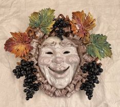 LARGE POTTERY MASK WITH FRUIT & LEAF SURROUND,