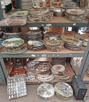 LARGE SELECTION OF WALL PLATES, 2 STAMP ALBUMS, LARGE SELECTION OF PORCELAIN THIMBLES IN RACKS,
