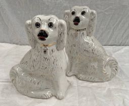 PAIR OF 19TH CENTURY WALLY DOGS.