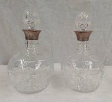 PAIR OF SILVER MOUNTED CUT GLASS DECANTERS