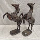 PAIR OF BENIN STYLE METAL REARING HORSES,