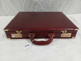 LEATHER BRIEFCASE WITH FITTED INTERIOR & BRASS MOUNTS, & LOCK INSTRUCTION CARD BY SERIAL 2100.