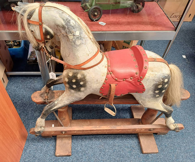 20TH CENTURY WOODEN CARVED ROCKING HORSE WITH PAINTED DECORATION.