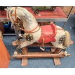 20TH CENTURY WOODEN CARVED ROCKING HORSE WITH PAINTED DECORATION.