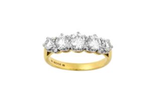 An 18 Carat Gold Diamond Five Stone Ring the graduated round brilliant cut diamonds in white claw