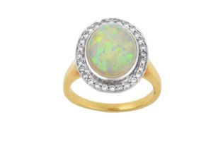 An Opal and Diamond Cluster Ring the oval cabochon opal in a white rubbed over setting, within a