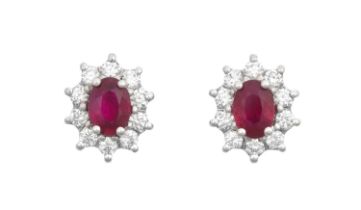 A Pair of 18 Carat White Gold Ruby and Diamond Cluster Earrings the oval cut rubies within borders