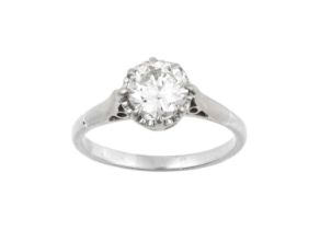 A Diamond Solitaire Ring the round brilliant cut diamond in a white claw setting, to a tapered