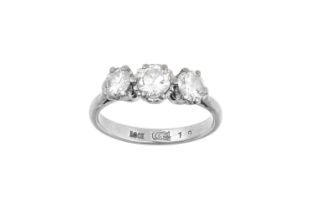 A Diamond Three Stone Ring the round brilliant cut diamonds in white claw settings, to a tapered