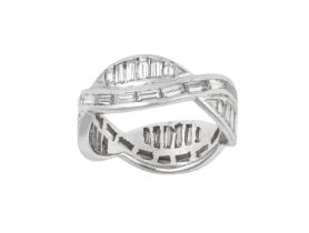 A Diamond Eternity Ring two entwined rows of baguette cut diamonds in a white channel setting, one