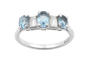 An Aquamarine and Diamond Five Stone Ring three oval cut aquamarines spaced by baguette cut