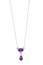 An Amethyst and Diamond Necklace the oval cut amethyst flanked by trefoil motifs comprising of round