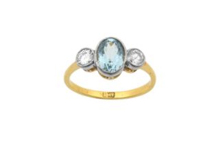 An Aquamarine and Diamond Three Stone Ring the oval cut aquamarine flanked by round brilliant cut