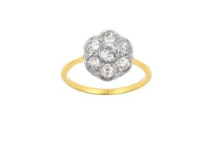 A Diamond Cluster Ring the central raised old cut diamond within a border of old cut diamonds, in