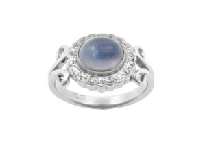 A Moonstone and Diamond Cluster Ring the oval cabochon moonstone within a border of old cut