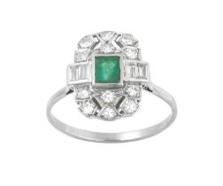 An Emerald and Diamond Ring the openwork plaque with an emerald-cut emerald centrally and set