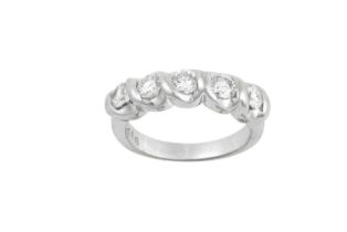 A Diamond Five Stone Ring the round brilliant cut diamonds in white rubbed over settings, to a plain