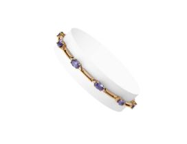 A Tanzanite and Diamond Bracelet and Ring the bracelet comprising of ten oval cut tanzanites flanked