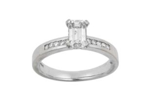 An 18 Carat White Gold Diamond Solitaire Ring the emerald-cut diamond in a four claw setting, to