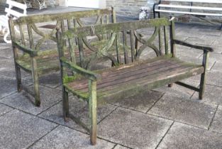 A Pair of Teak Hardwood Garden Benches, 20th century, with X-form supports above slatted seats, in