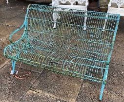 A Regency Style Wire Work Garden Seat, late 19th century, of scrolled form and repainted green (a/f)