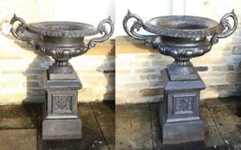 A Pair of Victorian-Style Cast Metal Garden Urns, later painted black, the moulded rims with