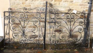 A Pair of Wrought Iron Garden Gates, early 20th century, of scrolled form with pivoting handle and