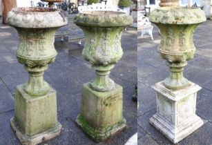 A Pair of Victorian Painted and Weathered Garden Urns, late 19th century, of campana-shape form with