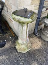 A Composition Circular Column Garden Pedestal, 20th century, the top mounted with a modern