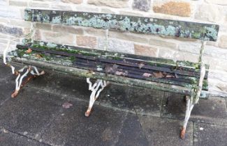 A Victorian Cast Iron Garden Bench, late 19th century, the frame as tree branches supporting a