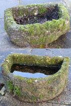 Two Stone Troughs, each of D-shape form, in weathered and moss-covered condition 58cm by 41cm and