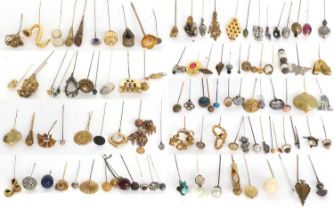 Assorted Early 20th Century Decorative Hat Pins in gilt metal, silvered metals, mounted with