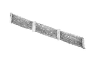 A Diamond Bracelet multiple white trace link chains interspaced with round brilliant cut diamonds in