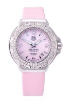 Tag Heuer: A Lady's Stainless Steel Diamond Set Calendar Centre Seconds Wristwatch, signed Tag