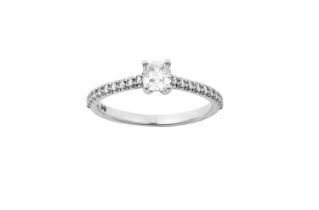 A Diamond Solitaire Ring, by Tiffany & Co. the cushion cut diamond in a four claw setting, to