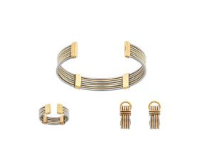 A Bi-Colour Bangle, Ring and Earring Suite, by Cartier of torque form, with alternate white and