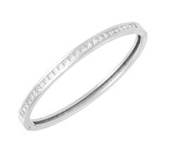 An 18 Carat White Gold Diamond Bangle the twenty-six princess cut diamonds in a channel setting,