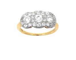 A Diamond Triple Cluster Ring three old cut diamonds within a border of smaller old cut diamonds, in