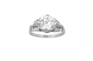 A Diamond Solitaire Ring, circa 1940 the round brilliant cut diamond in a white claw setting, to