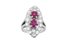 A Ruby and Diamond Cluster Ring the navette shaped cluster formed of two raised round cut rubies