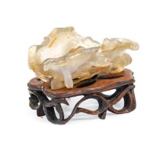 A Chinese Agate Brush Washer, Qing Dynasty, 18th/19th century, carved as a lily leaf and tendrils