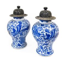 A Pair of Chinese Porcelain Baluster Jars, Kangxi, painted in underglaze blue with phoenix amongst