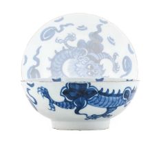 An English Delft Bowl, mid 18th century, painted in blue with a dragon amongst clouds 20cm