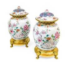 A Pair of Gilt-Metal-Mounted Chinese Porcelain Jars and Matched Covers, 18th century and later, of