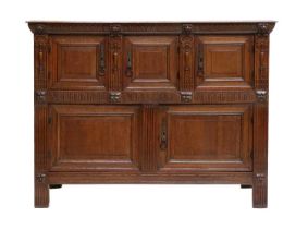 A Late 18th Century Dutch Carved Oak Sideboard, the moulded top above a carved frieze and lion