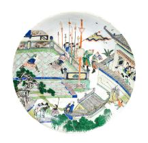 A Chinese Porcelain Charger, Kangxi, painted in famille verte enamels with two sporting combatants