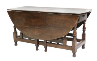 A Joined Oak Six-to-Eight-Seater Dropleaf Dining Table, late 17th/early 18th century, with two