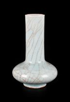 ~ A Chinese Guan-Style Porcelain Bottle Vase, Qing Dynasty, of squat ovoid form with tall