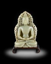 ~ A Chinese Pale Celadon Jade Figure of Buddha, Qing Dynasty, 18th/19th century, in meditation